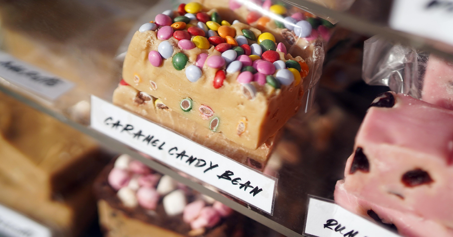 close up picture of fudge bar decorated with colourful sweets